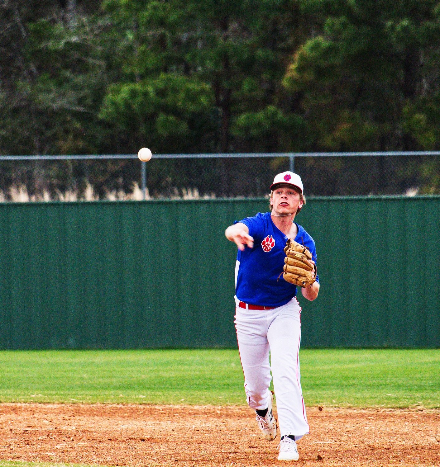 Blake Weissert makes a throw to first from shortstop.